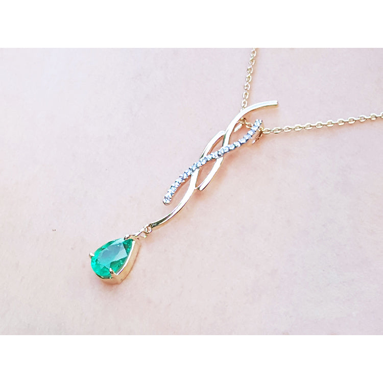 USA made emerald jewelry necklaces a 1.00 carat dangling pear cut emerald 14k yellow gold intertwined diamond design