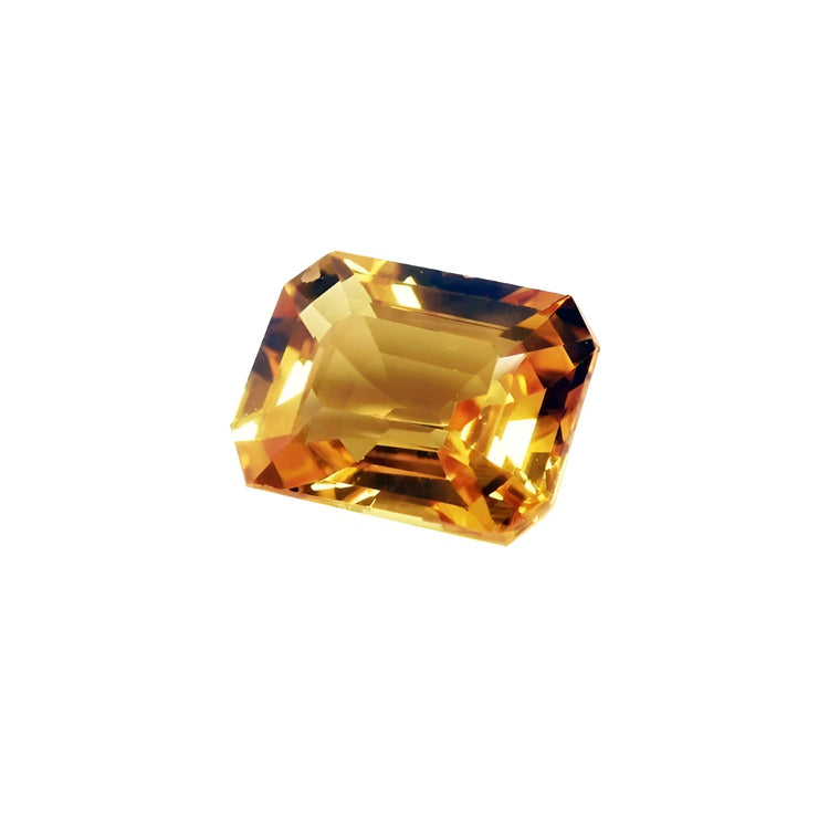 Loose yellow sapphire emerald cut from Sri Lanka, ideal for crafting a ring, pendant, or necklace.