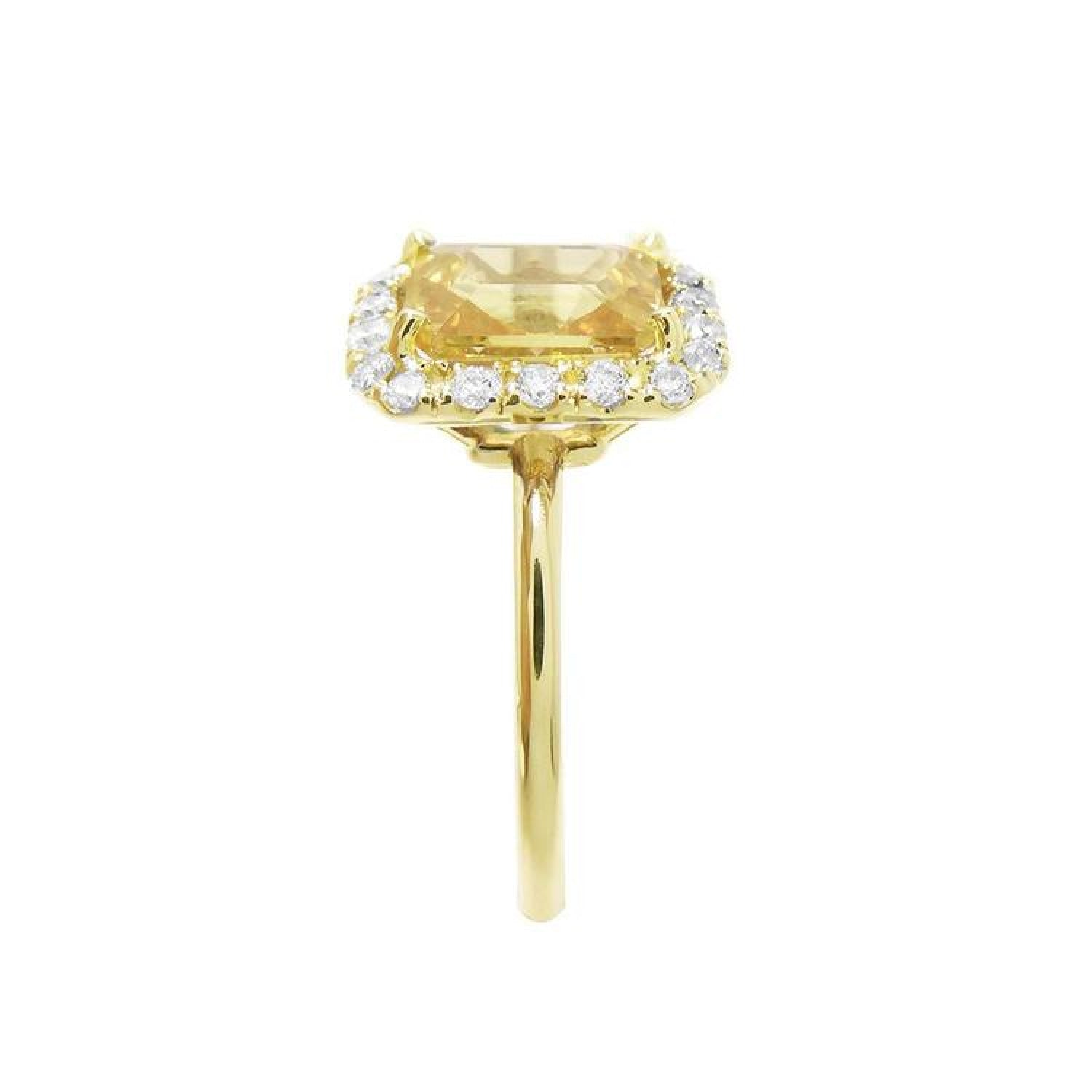 14K yellow gold ring with emerald-cut natural yellow sapphire and diamond halo.