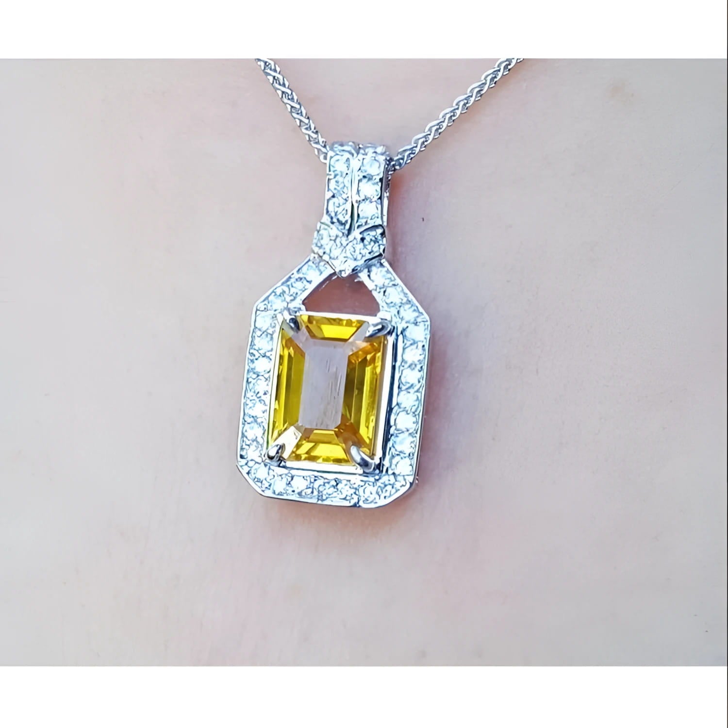 Natural yellow sapphire pendant necklace halo diamond crafted in 18k white gold, offering a refined and sophisticated accessory for women.