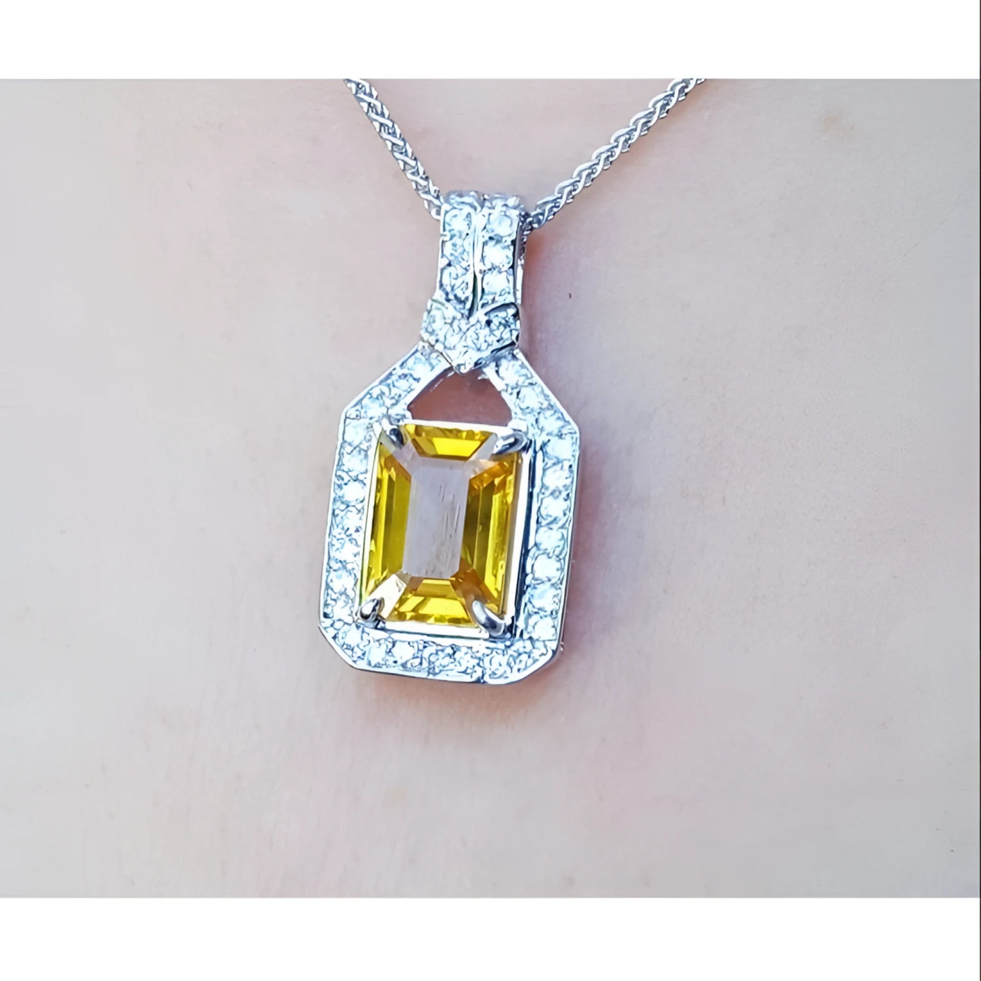 Natural yellow sapphire pendant necklace halo diamond crafted in 18k white gold, offering a refined and sophisticated accessory for women.