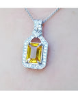 Natural yellow sapphire pendant necklace halo diamond crafted in 18k white gold, offering a refined and sophisticated accessory for women.