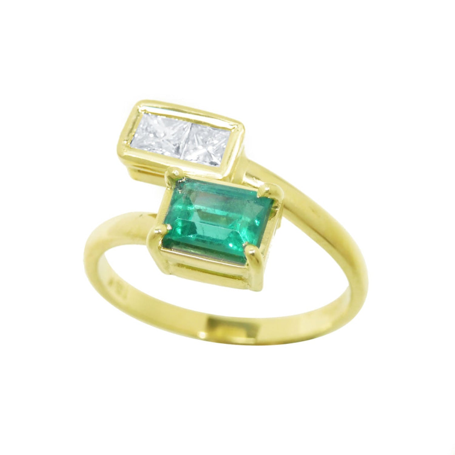 This You and me emerald and diamond engagement ring with a rectangular colombian emerald and two princess-cut natural diamonds was hand-crafted in 18k gold