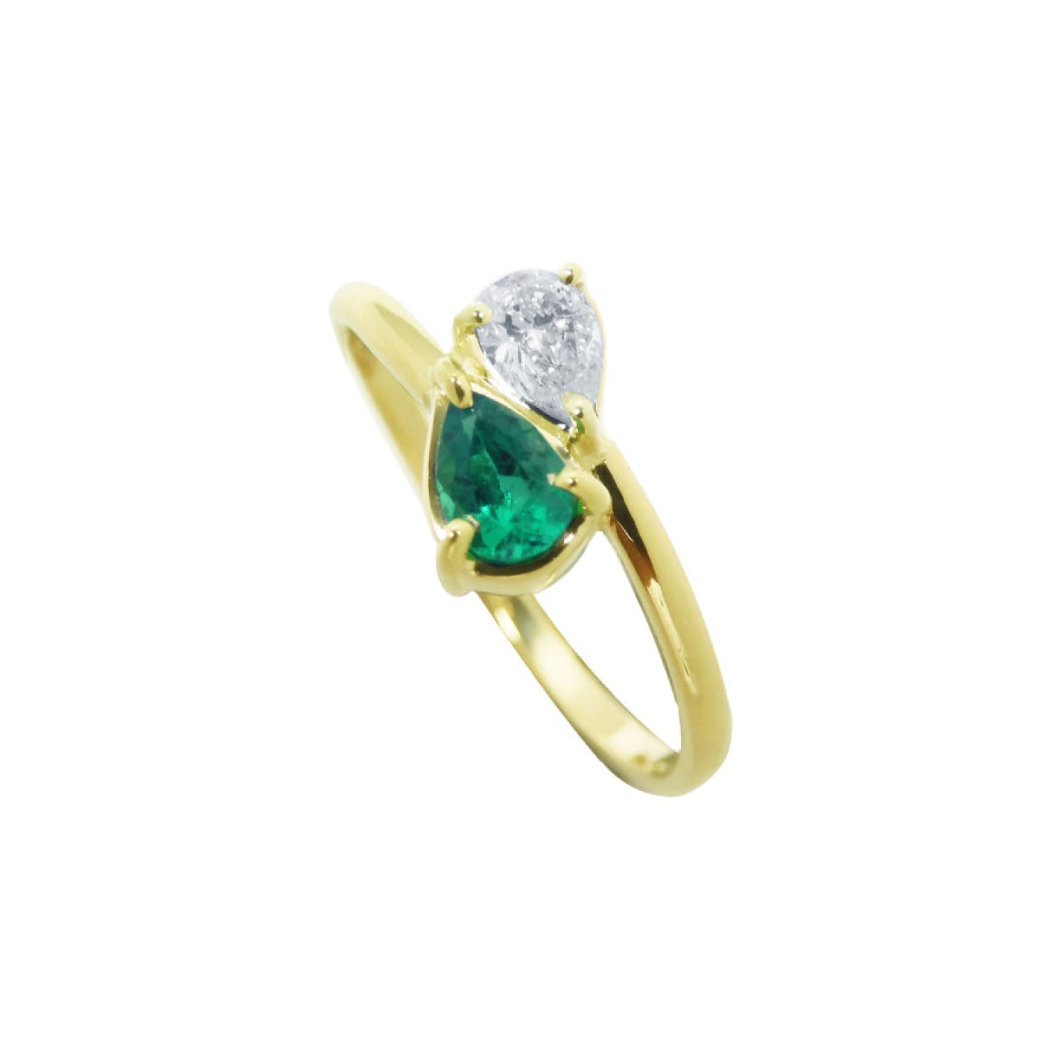 You and Me emerald and diamond ring features a paired pear-cut natural diamond in the classic toi et moi style, handcrafted in 18k yellow gold.