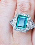 Emerald and trillion cut diamond rings